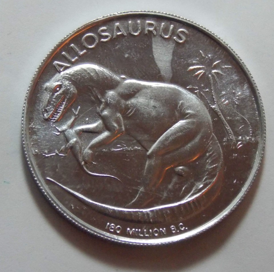 vintage allosaurus dinosaur aluminum token  7 49